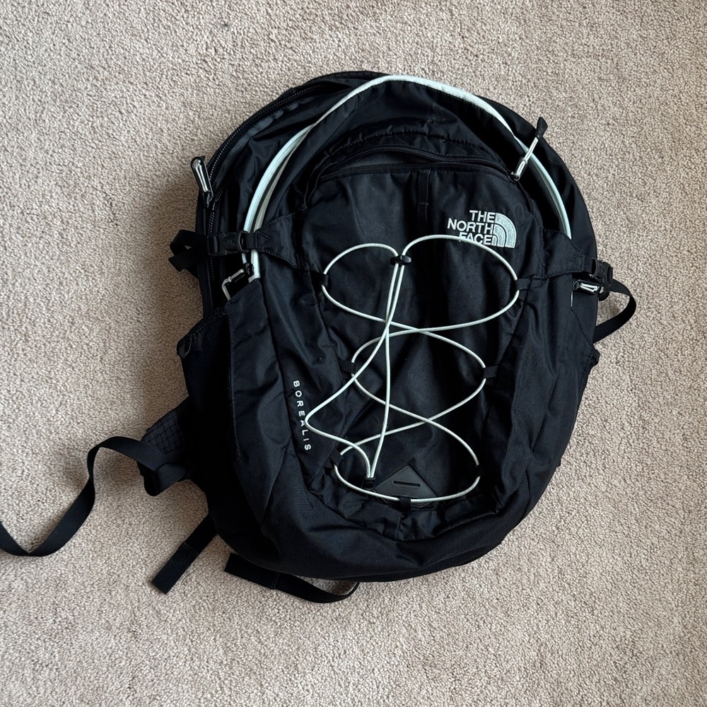 The North Face Black Backpack with White Bungee